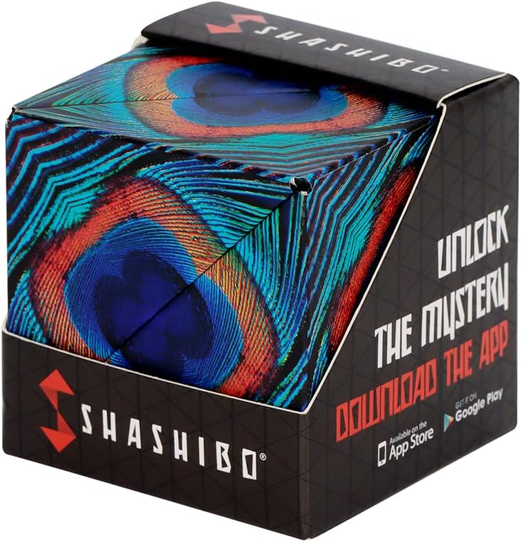 Shashibo Wings puzzle cube in its box, printed with a close-up peacock feather in blue, green and copper