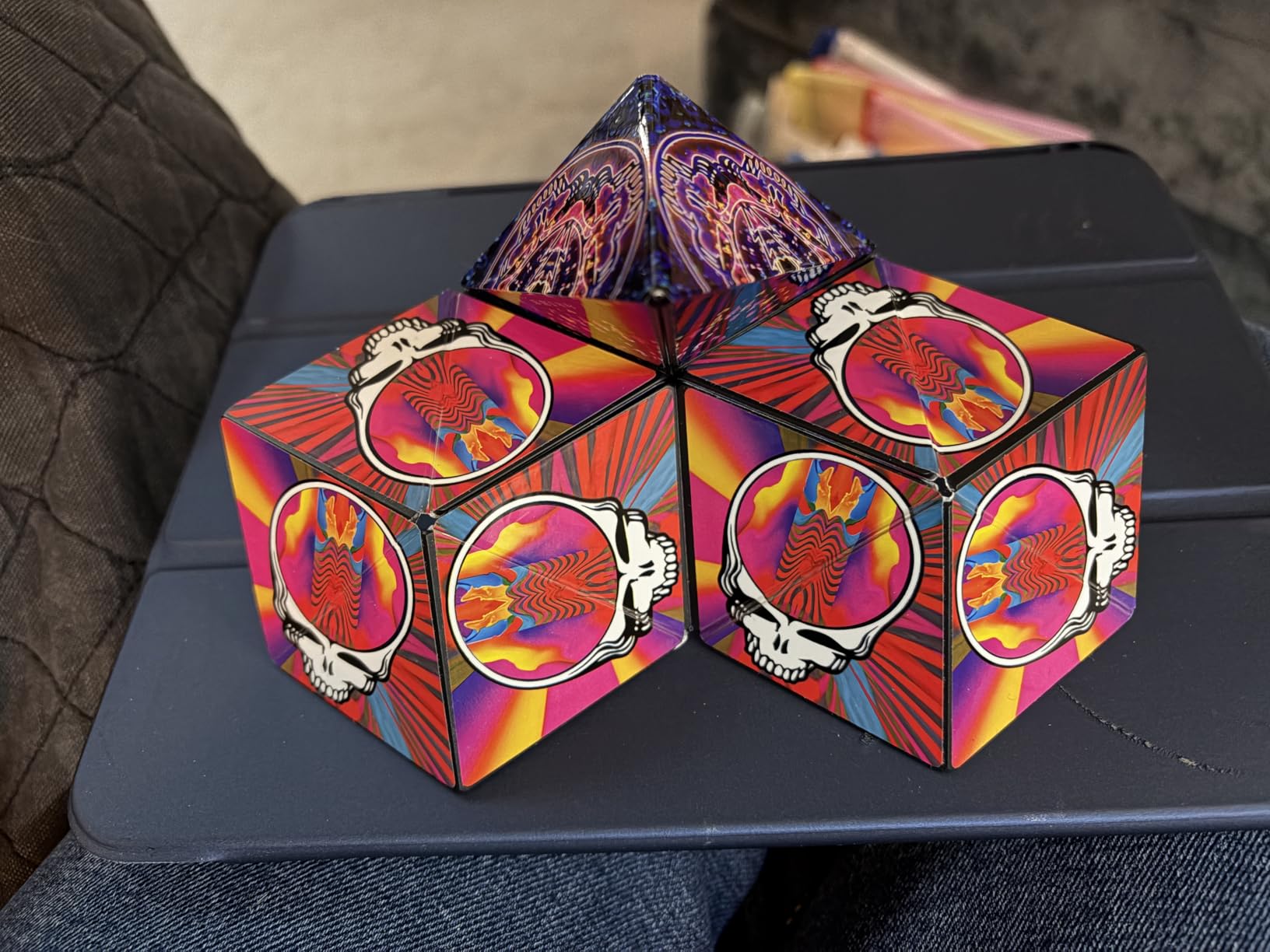 Customer photo of two Grateful Dead Shashibo cubes connected side by side with a third folded to a point on top